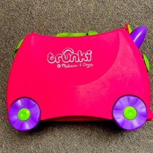 Melissa and Doug Trunki suitcase and ride on toy.